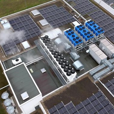 Aerial view of an industrial rooftop featuring  a central HVAC system Aerial view of an industrial rooftop featuring  a central HVAC system
